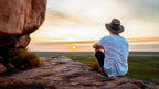 Man watches sunset over wetlands during Kakadu Katherine Gorge Tour | 4-Day Comfort Travel. Scenic view highlights peaceful nature retreat.