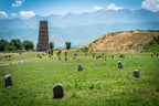 Burana Tower and ancient stone markers in Kyrgyzstan, a historic Silk Road site visited on the 14-23 Day Central Asia Silk Road Tour.