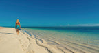 Traveler walking along pristine beach at Exmouth during West Coast Road Trip. Coastal exploration in Western Australia.