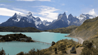 Panoramic view of turquoise lake and Torres del Paine mountains on Patagonia Hiking Tours - Blue Heart Adventure | 9 Days. Lodge and camping options.