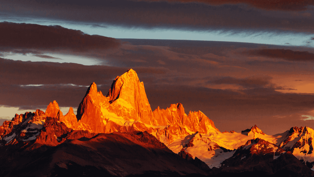 Sunset glow on Fitz Roy mountain in Patagonia, a highlight of the 9-day Blue Heart Adventure hiking tour through Torres del Paine and Argentina.