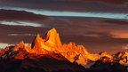 Sunset glow on Fitz Roy mountain in Patagonia, a highlight of the 9-day Blue Heart Adventure hiking tour through Torres del Paine and Argentina.