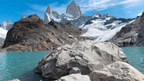 Rocky shoreline and turquoise lake beneath Fitz Roy peaks in Patagonia, part of the 9-day Blue Heart Adventure hiking tour. Ideal for trekking enthusiasts.