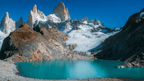 Turquoise glacial lake beneath rugged peaks in Patagonia, featured in the Blue Heart Adventure | 9 Days. Part of the Turquoise Lakes Circuit trek.