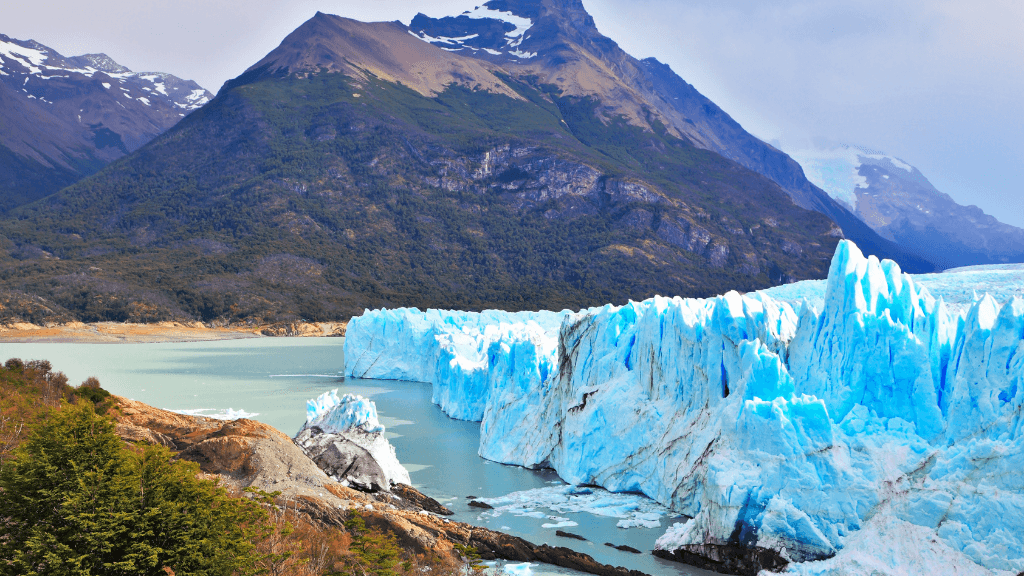 Bright blue glacier meeting turquoise lake in Patagonia, a highlight of the Blue Heart Adventure | 9 Days. Stunning views on the Turquoise Lakes Circuit.
