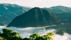 Lush mountain landscape with mist in the Philippines, scenic trekking in Philippines Travel Tours - Icons of the Philippines.