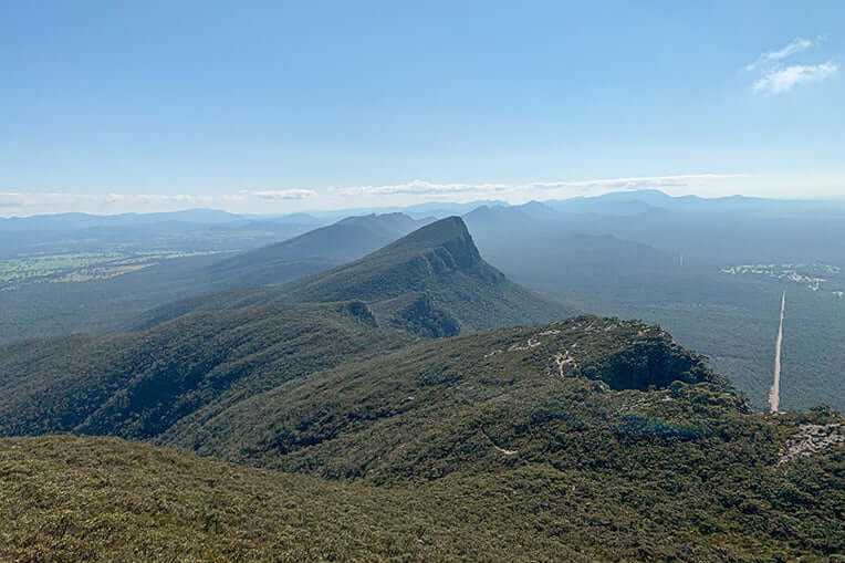 Stunning panoramic view of the Grampians Peaks showcasing lush valleys and dramatic ridgelines.