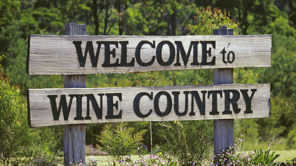 Welcome to Wine Country sign, part of winery visit on East Coast Australia tour. Cultural stop on 8-day Sydney to Brisbane itinerary.