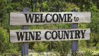 Welcome to Wine Country sign, part of winery visit on East Coast Australia tour. Cultural stop on 8-day Sydney to Brisbane itinerary.