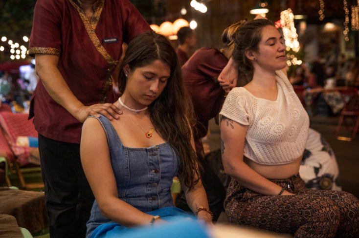 Tourists enjoy traditional Thai massage at night market, a relaxing treat on the Angkor to Islands 16-Day Tour - Khmer Culture to Thai Coasts.