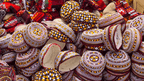 Traditional embroidered caps at a Central Asian market, showcasing local crafts on the Silk Road Cities Tour - Central Asia Adventure.