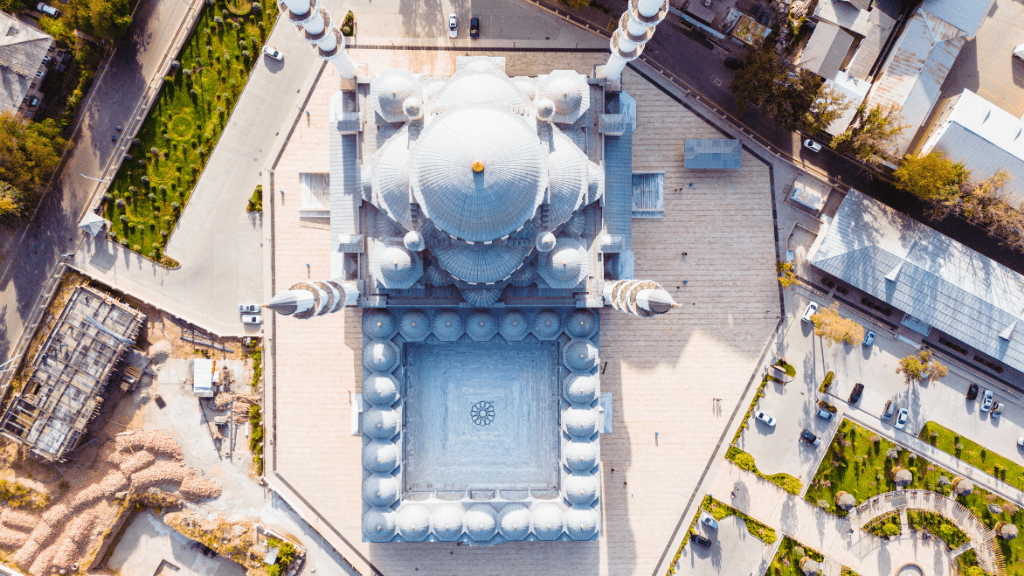 Aerial view of a grand mosque in Central Asia, showcasing Islamic architecture on the Silk Road Cities Tour - Central Asia Adventure.
