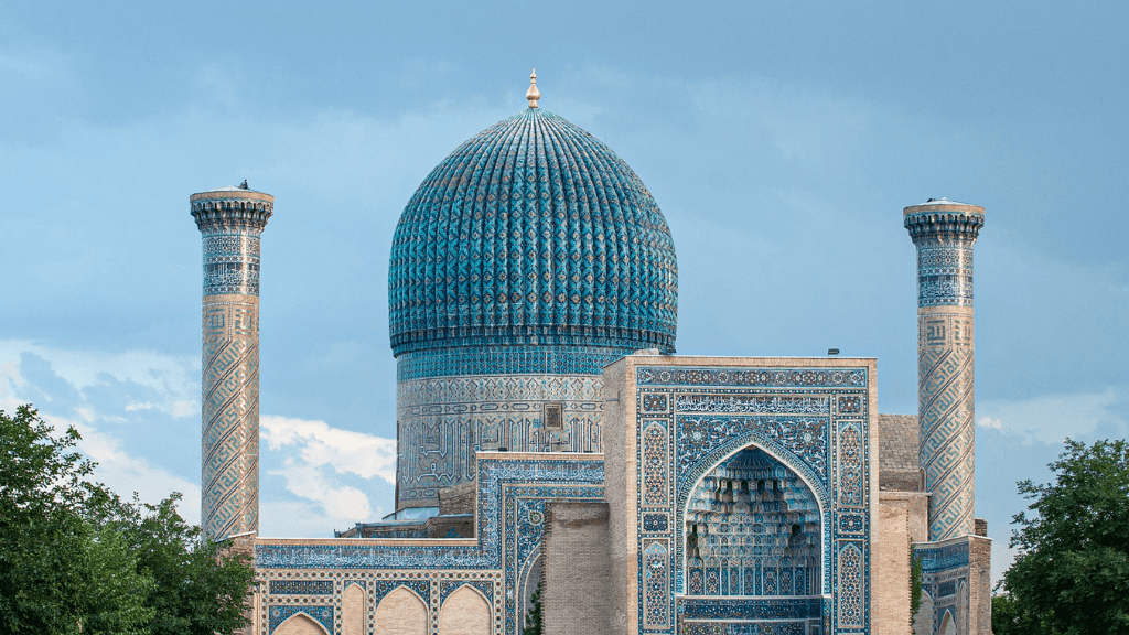 Blue-domed Gur-e-Amir Mausoleum in Samarkand, a key stop on the Silk Road Cities Tour - Central Asia Adventure through Uzbekistan.