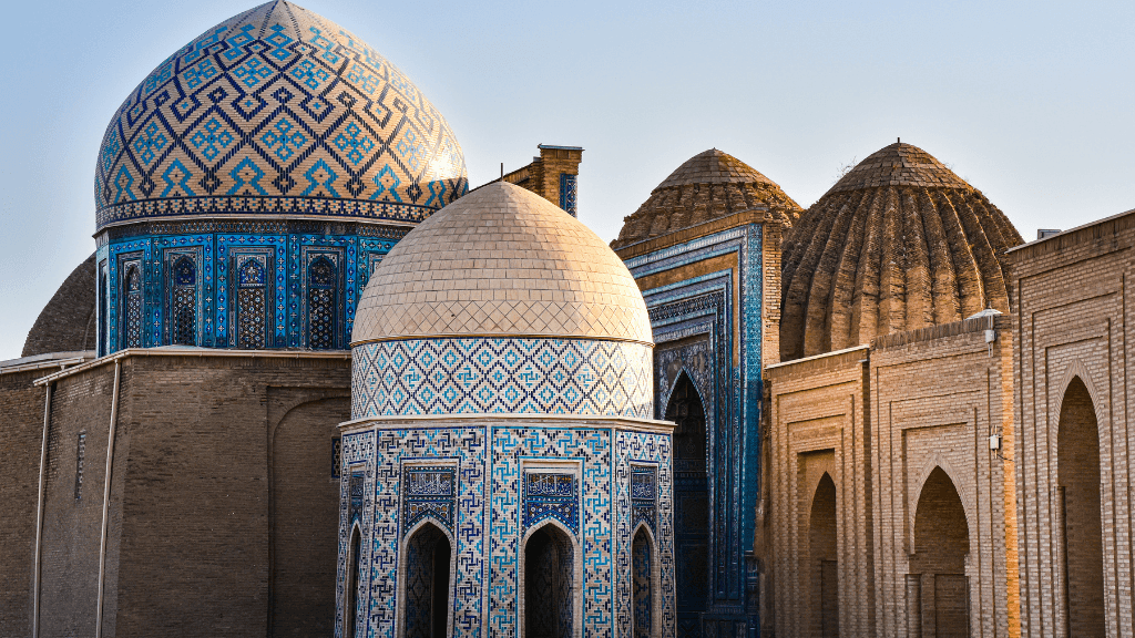 Shah-i-Zinda necropolis with intricate blue tilework in Samarkand, a cultural gem on the Silk Road Cities Tour - Central Asia Adventure.