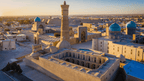 Panoramic view of Bukhara’s historic center at sunset, a key destination on the Silk Road Cities Tour - Central Asia Adventure.