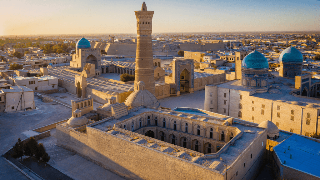 Panoramic view of Bukhara’s historic center at sunset, a key destination on the Silk Road Cities Tour - Central Asia Adventure.
