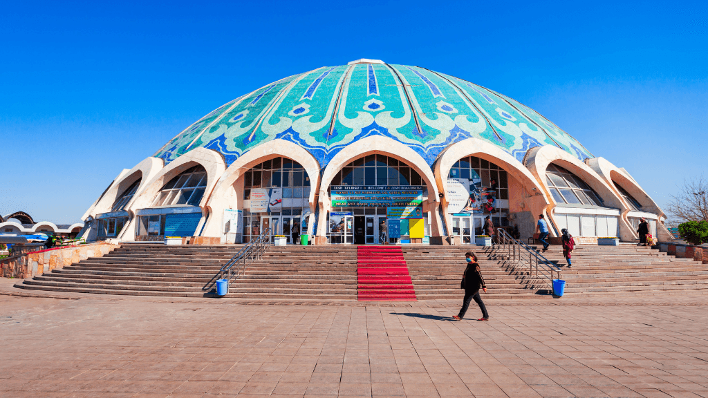 Colorful domed Chorsu Bazaar in Tashkent, Uzbekistan, a cultural shopping experience on the Silk Road Cities Tour - Central Asia Adventure.