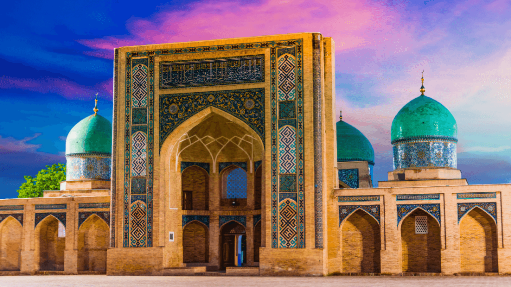 Historic mosque with turquoise domes at sunset in Tashkent, Uzbekistan, visited on the Silk Road Cities Tour - Central Asia Adventure.