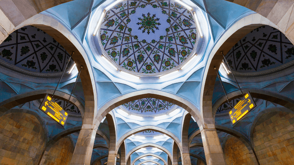 Decorative ceiling of Tashkent Metro station, a unique architectural stop on the Silk Road Cities Tour - Central Asia Adventure.
