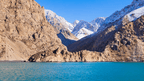 Blue lake surrounded by rugged mountains in Tajikistan, a scenic stop on the Silk Road Cities Tour - Central Asia Adventure.