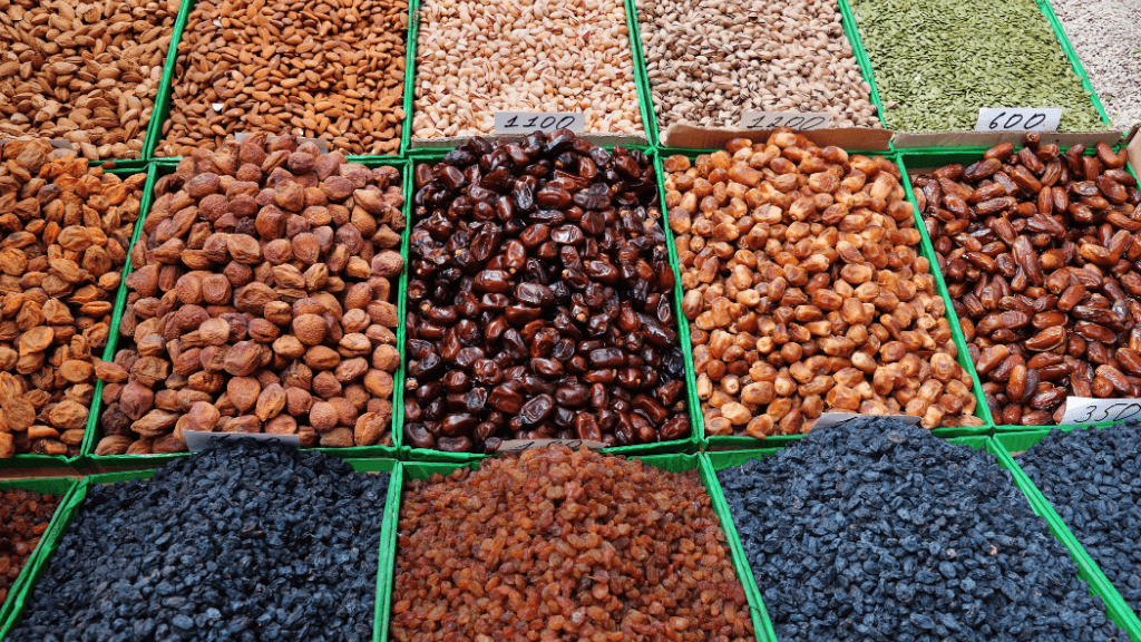 Colorful dried fruits and nuts at a Central Asian bazaar, part of the culinary experience on the Silk Road Cities Tour - Central Asia Adventure.