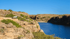 Scenic view of rocky cliffs and turquoise waters at Cape Range National Park, Western Australia.