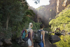 Two hikers exploring a breathtaking outdoor landscape in Kakadu National Park, highlighting adventure and nature.