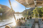 Group enjoying a scenic boat tour on the Mary River, capturing the beauty of the Top End adventure.
