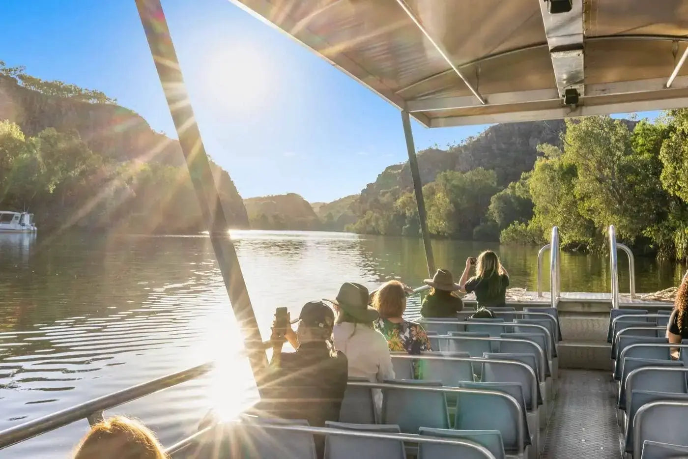 Group enjoying a scenic boat tour on the Mary River, capturing the beauty of the Top End adventure.